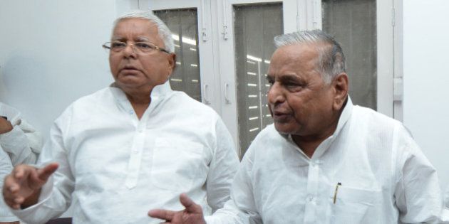 NEW DELHI,INDIA JUNE 08: Samajwadi Party chief Mulayam Singh Yadav and RJD Chief Lalu Prasad Yadav after a press conference regarding JD(U)-RJD alliance for Bihar elections, in New Delhi.(Photo by Praveen Negi/India Today Group/Getty Images)
