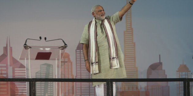 Indian Prime Minister Narendra Modi arrives at a cricket stadium to talk to Indian expatriates, Monday, Aug. 17, 2015, in Dubai, United Arab Emirates. The UAE is home to over two million Indian expatriates and this is the first visit by an Indian premier in over three decades. (AP Photo/Kamran Jebreili)