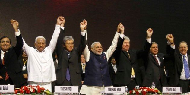 From Left to right, Reliance Industries Limited Chairman Mukesh Ambani, former Gujarat finance minister Vajubhai Vala, Ambassador of Japan to India Takeshi Yagi, Gujarat Chief Minister Narendra Modi, High Commissioner of Canada to India Stewart Beck, retired Chairman of Tata group Ratan Tata and British High Commissioner to India James Bevan hold and raise their hands as they pose for photographs during the inauguration of the 6th Vibrant Gujarat Global Summit (VGGS) in Gandhinagar, India, Friday, Jan. 11, 2013. Vibrant Gujarat Global Summit is a biennial gathering for discussion and action on emerging business opportunities in Gujarat and beyond. (AP Photo/Ajit Solanki)