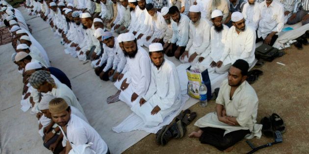 Members of the Jamiat Ulama-i-Hind (Organisation of Indian Scholars) pray at the start of an 'Anti-Terrorism Global Peace Conference' in Mumbai, India, Saturday, Feb. 14, 2009. Members of the Jamiat Ulama-i-Hind, one of India's leading Islamic organizations, resolved in condemning terrorism, according to a press handout. (AP Photo/Gautam Singh)