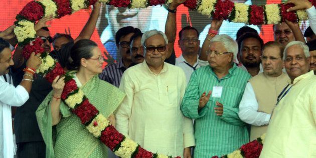 PATNA, INDIA - AUGUST 30: Congress President Sonia Gandhi with Bihar Chief Minister Nitish Kumar and RJD Chief Lalu Prasad during the Swabhiman rally at Gandhi Maidan, on August 30, 2015 in Patna, India. Gandhi attacked Modi on national level issues - his 'failure' to provide jobs to the youth, his 'anti-farmer' land bill, which he is now set to withdraw under Opposition from the Congress and the 'communal' agenda of the ruling BJP. (Photo by Santosh Kumar/Hindustan Times via Getty Images)