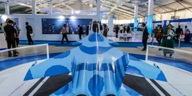 A model of the Sukhoi Su-30MKI fighter jet, a project by BrahMos Aerospace Pvt, a joint venture between Defence Research and Development Organisation (DRDO) of India and Military Industrial Consortium NPO Mashinostroyenia of Russia, stands on display during the Aero India air show at Air Force Station Yelahanka in Bengaluru, India, on Thursday, Feb. 19, 2015. The bi-annual Aero India exhibit is the premier event for nations and companies to get a piece of the $150 billion that the world's biggest arms importer plans to spend on modernizing its military. Photographer: Dhiraj Singh/Bloomberg via Getty Images