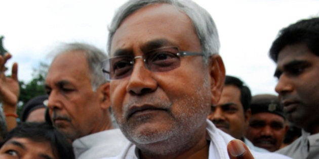 FILE - In this Nov. 1, 2010 file photo, Bihar state Chief Minister Nitish Kumar displays the indelible mark on his finger after casting his vote at a polling booth in Bakhtiyarpur, India. Kumar has won a landslide re-election victory Wednesday, Nov. 24, 2010 after a campaign that emphasized his efforts to bring development to Bihar and broke away from traditional caste-based politics. (AP Photo/Prashant Ravi, File)