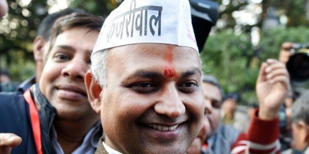 Senior Leader of India's Aam Aadmi Party (AAP) Somnath Bharti (C) arrives for a meeting in New Delhi on February 10, 2015. India's Narendra Modi suffered his first major election setback since becoming prime minister last May, as anti-corruption campaigner Arvind Kejriwal won a landslide victory in Delhi state polls. AFP PHOTO / SAJJAD HUSSAIN (Photo credit should read SAJJAD HUSSAIN/AFP/Getty Images)