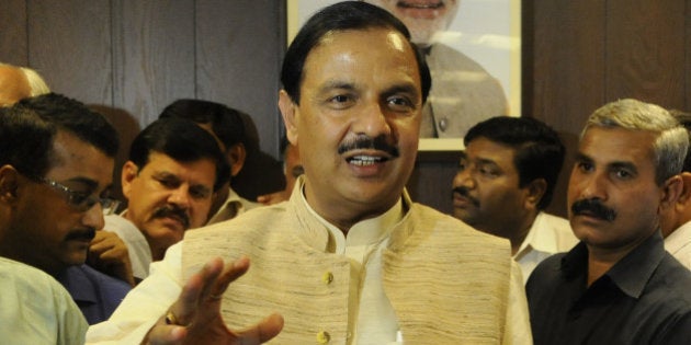 NEW DELHI, INDIA - NOVEMBER 12: BJP leader Mahesh Sharma takes charge as Minister Of State For Civil Aviation at Rajiv Gandhi Bhawan on November 12, 2014 in New Delhi, India. He also took charge as Minister Of State for Tourism and Culture. (Photo by Vipin Kumar/Hindustan Times via Getty Images)