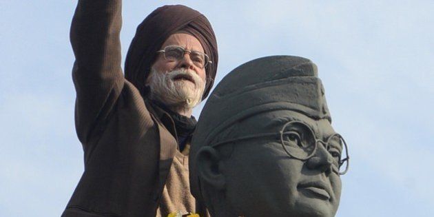 Member of the All India Azad Hind Fauj Freedom-Fighters Successors Association,Santokh Singh (C) gestures on the statue of freedom fighter, Netaji Subhash Chandra Bose in Amritsar on January 23, 2013, as part of celebrations for his 116th birth anniversary. Bose was a prominent Indian nationalist leader who attempted to gain India's independence from British rule by force during the waning years of World War II. AFP PHOTO/NARINDER NANU (Photo credit should read NARINDER NANU/AFP/Getty Images)