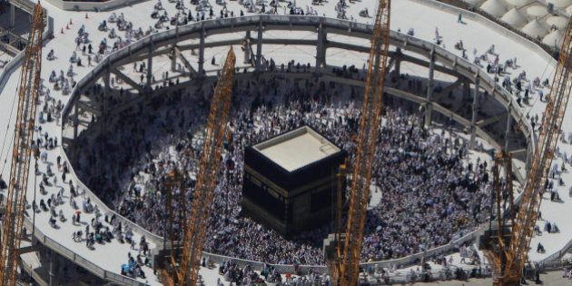 FILE - In this Wednesday, Oct. 16, 2013 file photo, cranes rise at the site of an expansion to the Grand Mosque as Muslim pilgrims circle counterclockwise around the Kaaba at the Grand Mosque in Mecca, Saudi Arabia. A towering construction crane toppled over on Friday, Sept. 11, 2015 during a violent rainstorm in the Saudi city of Mecca, Islamâs holiest site, crashing into the Grand Mosque and killing dozens of people ahead of the start of the annual hajj pilgrimage later this month.(AP Photo/Amr Nabil, File)