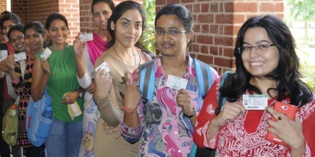 NEW DELHI, INDIA - SEPTEMBER 11: Students queue up to cast their vote for the Delhi Univesity Students Union (DUSU) Elections 2015, at Miranda House, North Campus, on September 11, 2015 in New Delhi, India. A total of 35 candidates are in the fray for the four posts of DUSU office-bearers. While nine candidates are in the race for the post of president, eight nominations have been validated for the post of vice-president. The number of students contesting for the secretary and joint secretary post is 10 and eight respectively. Students say they want a rollback of the Choice Based Credit System (CBCS) and proper hostel facilities. (Photo by Sushil Kumar/Hindustan Times via Getty Images)