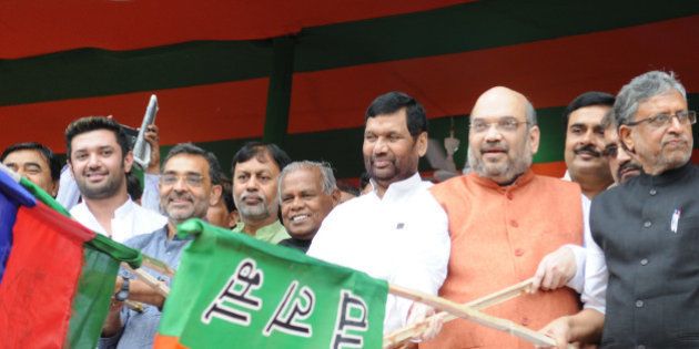 PATNA, INDIA - JULY 16: BJP Chief Amit Shah with LJP Chief Ram Vilas Paswan, HAM Chief Jitan Ram Manjhi, BJP leader Sushil Kumar Modi and other NDA leaders flagging off the 'Parivartan Rath at Gandhi Maidan on July 16, 2015 in Patna, India. These chariots will travel to all the villages spread covering 243 assembly seats of Bihar ahead of July 25 rally of Prime Minister Narendra Modi in Muzaffarpur. The party plans to hold 100,000 meetings in 100 days ahead of the elections. (Photo by AP Dube/Hindustan Times via Getty Images)