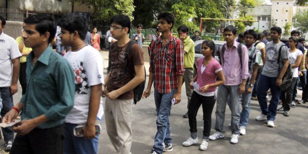 NEW DELHI, INDIA - APRIL 8: Students walk out of the examination center after appearing for IIT JEE 2012 at Modern School Barakhamaba Road on April 8, 2012 in New Delhi, India. As many as 5.6 lakh aspirants across the country appeared for the IIT Joint Entrance Exam 2012. (Photo by Sonu Mehta / Hindustan Times via Getty Images)