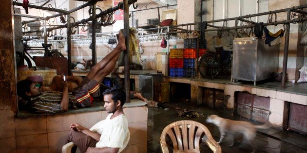 MUMBAI, INDIA - SEPTEMBER 10: Shopkeeper seen sitting idle at Crawford meat market on the first day of a four-day ban on the sale of meat on the occasion of Jain holy festival of Paryushan on September 10, 2015 in Mumbai, India. Earlier this week, the BMC imposed a ban on sale of meat on four days of the Paryushan festival, while the adjoining Mira-Bhayander Municipal Corporation in Thane had declared a complete ban during September 11-18. (Photo by Arijit Sen/Hindustan Times via Getty Images)