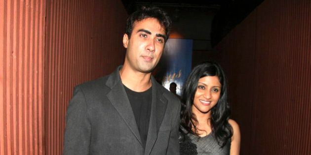 Indian Bollywood actors Ranvir Shorey (L) and his wife Konkona Sen Sharma (R) attend a Chivas promotional event in Mumbai on June 13, 2010. AFP PHOTO/STR (Photo credit should read AFP/AFP/Getty Images)