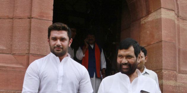 NEW DELHI, INDIA - AUGUST 5: Lok Janshakti Party supremo Ram Vilas Paswan with son Chirag Paswan at Parliament House, on August 5, 2015 in New Delhi, India. Congress and some opposition parties on Wednesday persisted with their protest against the suspension of 25 MPs as the stalemate in the Rajya Sabha continued over the opposition demand for the resignations of three BJP leaders. (Photo by Sanjeev Verma/Hindustan Times via Getty Images )