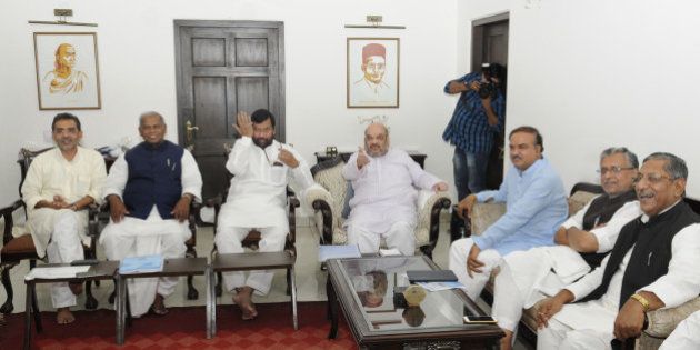 NEW DELHI, INDIA - AUGUST 31: BJP President Amit Shah, LJP Chief Ram Vilas Paswan, HAM(S) Supremo Jitan Ram Manjhi, RLSP President Upendra Kushwaha and other NDA leaders at a meeting to discuss the strategy for the upcoming Bihar assembly polls on August 31, 2015 in New Delhi, India. BJP led NDA is yet to announce on its seat sharing formula. The JD-U, RJD and Congress alliance has already announced its seat sharing arrangement for the 243-member Bihar assembly. (Photo by Sushil Kumar/Hindustan Times via Getty Images)