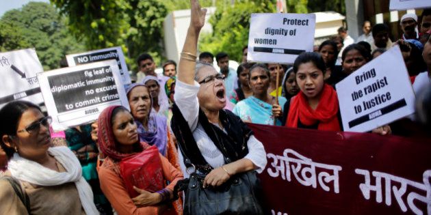 Activists of All India Democratic Women's Association shout slogans during a protest outside the Saudi Arabian embassy in New Delhi, India, Thursday, Sept. 10, 2015. Two Nepalese maids who alleged they were beaten and raped by a Saudi diplomat in India have been taken to a women's shelter in Nepal. (AP Photo/Altaf Qadri)