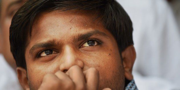 Indian convenor of the 'Patidar Anamat Andolan Samiti', Hardik Patel, who led recent protests in the state of Gujarat demanding preferential treatment regarding jobs and university places for the Patidar caste, looks on during a press conference in New Delhi on August 30, 2015. A firebrand protest leader vowed August 30 to spread agitation over caste preferences nationwide, just days after the worst violence in more than a decade in western India left nine people dead. AFP PHOTO / SAJJAD HUSSAIN (Photo credit should read SAJJAD HUSSAIN/AFP/Getty Images)