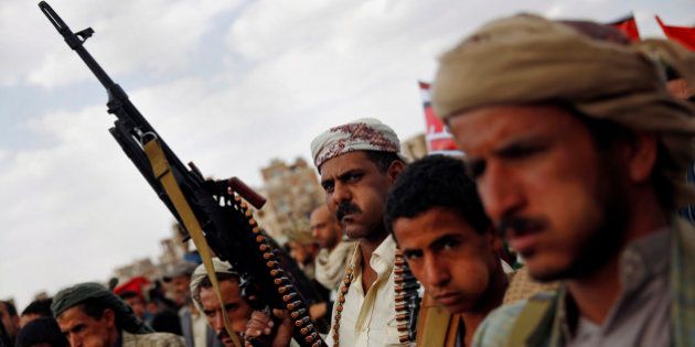 A Shiite Houthi rebel holds his weapon as he attends a rally to protest Saudi-led airstrikes, in Sanaa, Yemen, Monday, Aug. 24, 2015. The Saudi-led coalition fighting Shiite rebels in Yemen doubled its near-daily airstrikes in the central province of Marib and the adjacent border area of Jawf on Monday, paving the way for allies on the ground to push north toward Shiite rebel strongholds, military and security officials said. (AP Photo/Hani Mohammed)