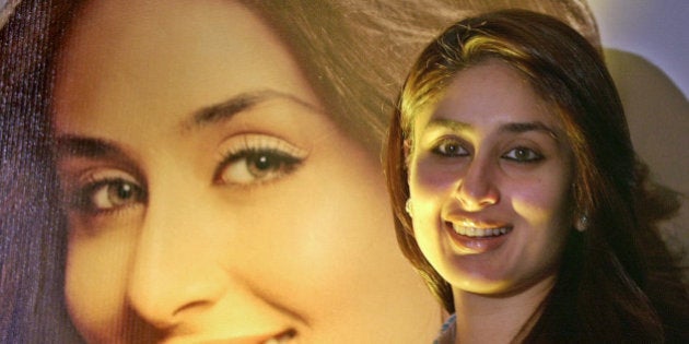 Bollywood actress Kareena Kapoor poses for the media during a promotional for Garnier in Bombay, India, Wednesday, Oct. 26, 2005. Garnier signed Kapoor as their brand ambassador. In the background is Kapoors poster. (AP Photo/Aijaz Rahi)