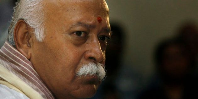 Mohan Bhagwat, chief of the Rashtriya Swayamsevak Sangh (RSS), or the National Volunteers Force, gestures during a press conference in New Delhi, India, Friday, Aug. 28, 2009. Bhagwat said that the RSS would not interfere in the internal party work of the Hindu nationalist Bharatiya Janata Party (BJP), with reference to the recent turmoil within the BJP. The RSS is the parent organization of the BJP. (AP Photo/Manish Swarup)