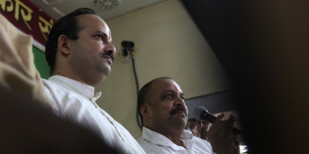 MUMBAI, INDIA - AUGUST 21: Sanatan Sanstha spokesperson Abhay Vartak and Hindu Vidhidnya Parisad secretary Sanjeev Punalekar addressing a press conference, in which they clarified that their organizations do not have any role in the murder of social activist Narendra Dabholkar, at Marathi Patrakar Sangh on August 21, 2013 in Mumbai, India. Narendra Dabholkar was shot dead by two men on a motorcycle while he was out for a morning walk near Omkareshwar Temple in Pune. Renowned rationalist Dabholkar had relentlessly campaigned for a law against superstition and black magic and was opposed by Hindu organization. The state government today cleared an Anti-Superstition and Black Magic Ordinance to replace a Bill that had been approved by the cabinet but had lapsed before it could be taken up in the assembly. The Bill has been pending for eight years. (Photo by Vijayaannd Gupta/Hindustan Times via Getty Images)