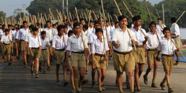 Volunteers of the militant Hindu group Rashtriya Swayamsevak Sangh (RSS) march through a street during a three-day workers camp on the outskirts of Ahmadabad, India, Saturday, Jan. 3, 2015. The RSS, parent organization of the ruling Bharatiya Janata Party, combines religious education with self-defense exercises. The organization has long been accused of stoking religious hatred against Muslims. (AP Photo/Ajit Solanki)