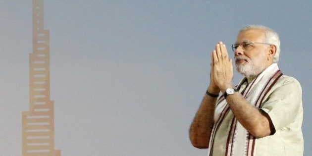 Indian Prime Minister Narendra Modi delivers a speech to members of the Indian expatriate community in the United Arab Emirates at the Dubai Cricket Stadium, on August 17, 2015, during a two-day visit to the UAE. Modi is the first Indian premier to visit the UAE in more than three decades since Indira Gandhi came in 1981 and is due to address the country's large India expat community in Dubai. Indians, who form the UAE's largest expatriate community, account for about 30 percent of the country's population of eight million, with many of them labourers who were behind the construction boom. AFP PHOTO / KARIM SAHIB (Photo credit should read KARIM SAHIB/AFP/Getty Images)