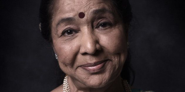 DUBAI, UNITED ARAB EMIRATES - DECEMBER 11: Singer Asha Bhosle is photographed at the 11th Annual Dubai International Film Festival held at the Madinat Jumeriah Complex, on December 11, 2014 in Dubai, United Arab Emirates. (Photo by Gareth Cattermole/Getty Images Portrait)