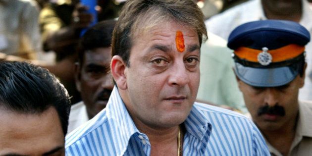 Bollywood actor Sanjay Dutt arrives to surrender before the Terrorist and Disruptive Activities (TADA) court in Mumbai, India, Tuesday, Dec. 19, 2006. Dutt, whose bail ends on Tuesday, was convicted under the Arms Act in India's lengthiest court trial over the March 12, 1993 bomb blasts that killed 257 people. (AP Photo/Gautam Singh)