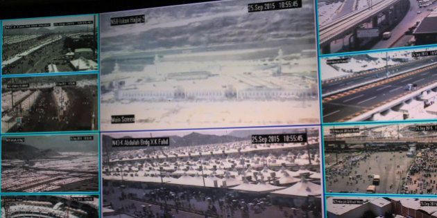 Muslim pilgrims attending the annual hajj pilgrimage are seen on CCTV screens at a security command in Mina, Saudi Arabia, in Friday, Sept. 25 2015, a day after a stampede killed more than 700 people. Saudi authorities are investigating what sparked Thursday's disaster in Mina, about 5 kilometers (3 miles) from Mecca. Initial reports suggested two crowds coming from opposing directions converged on an intersection, which began pushing and shoving until a stampede began. (AP Photo/Mosa'ab Elshamy)