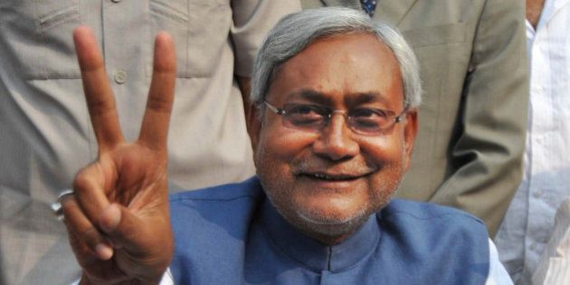 Bihar state Chief Minister Nitish Kumar displays the victory sign during a press conference after his National Democratic Alliance won the state elections, in Patna, India, Wednesday, Nov. 24, 2010. Kumar, the top elected official of one of India's poorest states, has won a landslide re-election victory after a campaign that emphasized his efforts to bring development to Bihar and broke away from traditional caste-based politics. (AP Photo/Aftab Alam Siddiqui)