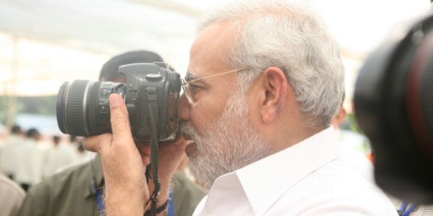 INDIA - NOVEMBER 12: Narendra Modi, Chief Minister of Gujarat with Camera in Gujarat, India ( Photographer ) (Photo by Shailesh Raval/The India Today Group/Getty Images)