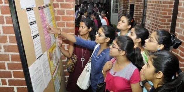 NEW DELHI, INDIA - SEPTEMBER 11: Students queue up to cast their votes for the Delhi Univesity Students Union (DUSU) Elections 2015, at Miranda House, North Campus, on September 11, 2015 in New Delhi, India. A total of 35 candidates are in the fray for the four posts of DUSU office-bearers. While nine candidates are in the race for the post of President, eight nominations have been validated for the post of Vice-President. The number of students contesting for the secretary and joint secretary post is 10 and eight respectively. Students say that they want a rollback of the Choice Based Credit System (CBCS) and proper hostel facilities. (Photo by Sushil Kumar/Hindustan Times via Getty Images)