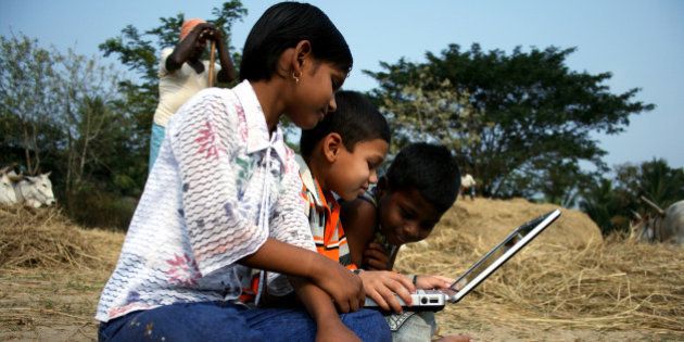 Young children using a laptop