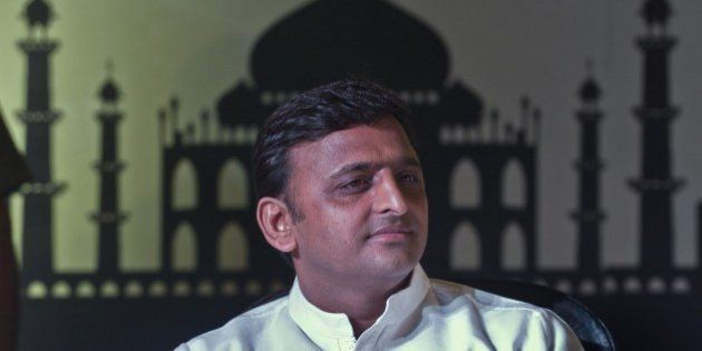 Uttar Pradesh (UP) Chief Minster Akhilesh Yadav listens during the UP Investor Conclave in New Delhi on June 12, 2014. The Uttar Pradesh government signed 20 initial agreements with corporates entailing investments worth 35,000 crore rupees (59 million dollars) during the investors conclave. AFP PHOTO/Prakash SINGH (Photo credit should read PRAKASH SINGH/AFP/Getty Images)