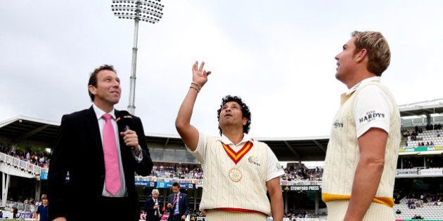 LONDON, ENGLAND - JULY 05: MCC captain Sachin Tendulkar tosses the coin alongside Rest of the World captain Shane Warne during the MCC and Rest of the World match at Lord's Cricket Ground on July 5, 2014 in London, England. (Photo by Ben Hoskins/Getty Images)