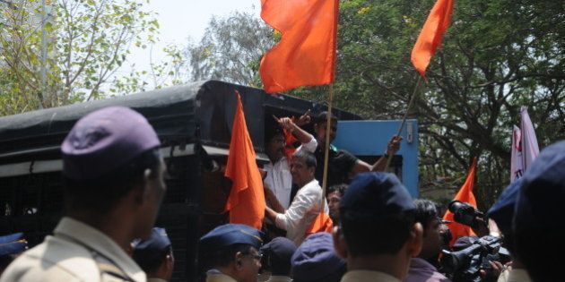 MUMBAI, INDIA - APRIL 9: Shiv Sena party workers protest outside Shobha De's House by presenting Vada Pav and Misal for her tweets on Marathi food on April 9, 2015 in Mumbai, India. De has invited wrath of ruling Shiv Sena over her tweet in which she slammed government for its directive asking private multiplexes to screen Marathi films in prime time slots between 6-9 PM. (Photo by Anshuman Poyrekar/Hindustan Times via Getty Images)