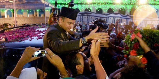 Indian Muslim leader of All India Majlis-e-Ittihad al-Muslimin and member of the Legislative Assembly of the state of Telangana Akbaruddin Owaisi (C) shakes hands with members of his community during a visit to an 'Iftar' party held to break the Ramadan fast in Bangalore on July 9, 2015. Muslim devotees globally are marking the month of Ramadan by fasting from dawn until dusk. AFP PHOTO/Manjunath KIRAN (Photo credit should read MANJUNATH KIRAN/AFP/Getty Images)
