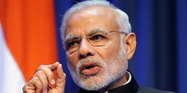 Indian Prime Minister Narendra Modi gestures as he delivers a joint press conference with the Irish prime minister at Goverment Buildings in Dublin, Ireland, on September 23, 2015. AFP PHOTO / PAUL FAITH (Photo credit should read PAUL FAITH/AFP/Getty Images)