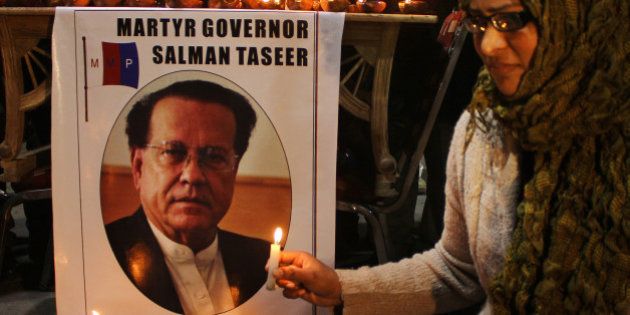LAHORE, PUNJAB, PAKISTAN - 2015/01/05: A woman holds a candle during the commemoration of the 4th death anniversary of Governor Salman Taseere. Salman Taseer, was shot and killed by his own guard, Mumtaz Qadri, in broad day light in December 2011 in capital city Islamabad. (Photo by Rana Sajid Hussain/Pacific Press/LightRocket via Getty Images)