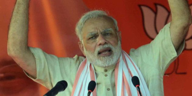 Indian Prime Minister Narendra Modi speaks during an election rally in Banka district of the eastern Indian state of Bihar, Friday, Oct. 2, 2015. The five-phased polls in the state will begin on Oct. 12. (AP Photo/Aftab Alam Siddiqui)