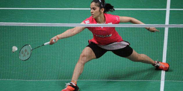 JAKARTA, INDONESIA - AUGUST 15: Saina Nehwal of India competes against Lindaweni Fanetri of Indonesia in the semi final match of the 2015 Total BWF World Championship at Istora Senayan on August 15, 2015 in Jakarta, Indonesia. (Photo by Robertus Pudyanto/Getty Images)