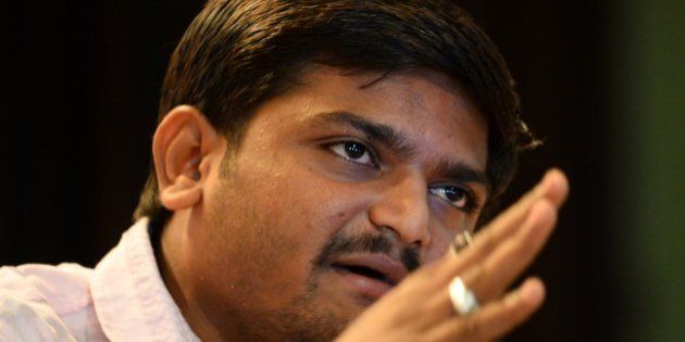 Indian convenor of the 'Patidar Anamat Andolan Samiti' movement Hardik Patel addresses a press conference in New Delhi on September 30, 2015. Patel led recent protests in the state of Gujarat demanding preferential treatment regarding jobs and university places for the Patidar caste. AFP PHOTO / SAJJAD HUSSAIN (Photo credit should read SAJJAD HUSSAIN/AFP/Getty Images)