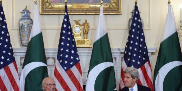 US Secretary of State John Kerry (R) speaks as Pakistan's National Security and Foreign Affairs Advisor Sartaj Aziz listens during a meeting at the State Department in Washington, DC, on January 27, 2014 as part of the revitalized US-Pakistan Strategic Dialogue process.. AFP PHOTO/Jewel Samad (Photo credit should read JEWEL SAMAD/AFP/Getty Images)