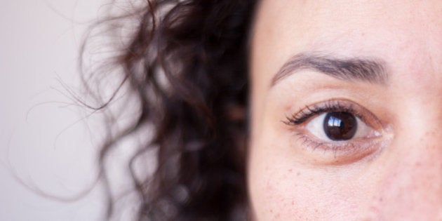 Close up of a woman's brown eye, strong selective focus