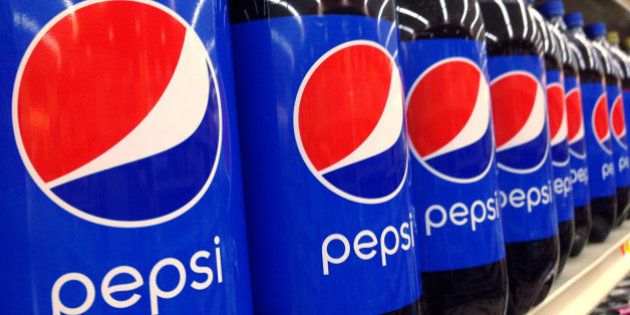 FILE - In this July 9, 2015, file photo, Pepsi bottles are on display at a supermarket in Haverhill, Mass. Pepsico reports quarterly financial results on Tuesday, Oct. 6, 2015. (AP Photo/Elise Amendola, File)