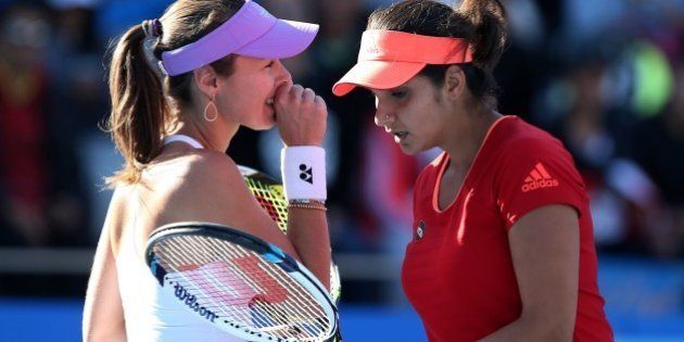 BEIJING, CHINA - OCTOBER 08: (CHINA OUT) Sania Mirza of India (R) and Martina Hingis of Switzerland in action during their women's doubles quarter-final match against Julia Goerges of Germany and Karolina Pliskova of the Czech Republic at the China Open tennis tournament on October 8, 2015 in Beijing, China. (Photo by ChinaFotoPress/ChinaFotoPress via Getty Images)