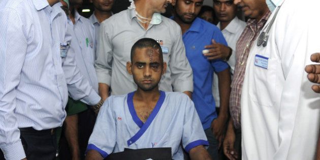 NOIDA, INDIA - OCTOBER 10: Dadri lynching victim Akhlaq's son Danish (22), being shifted to Army Research and Referral (R&R) Hospital in Dhaula Kuan, Delhi, from Kailash Hospital, Noida, on October 10, 2015 in Noida, India. Danish was attacked and Akhlaq was killed by the mob after rumours that the family had consumed and stored beef in their house at Bishara village in Dadri, Uttar Pradesh. (Photo by Sunil Ghosh/Hindustan Times via Getty Images)