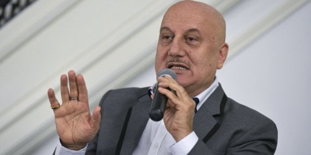 From left: Indian actors Anupam Kher takes part in a discussion on the links between Indian theater and cinema at Embassy of India on August 20, 2015 in Washington, DC. AFP PHOTO/MANDEL NGAN (Photo credit should read MANDEL NGAN/AFP/Getty Images)