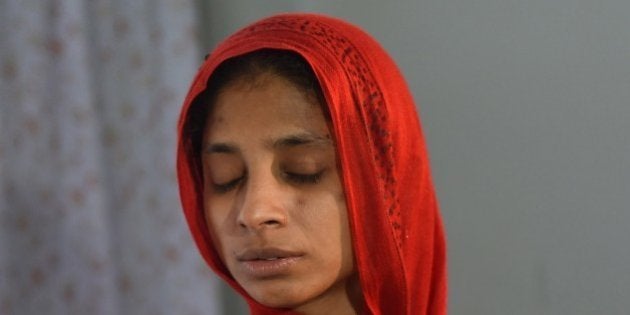 To go with Pakistan-India-missing-diplomacy,FOCUS by Ashraf KHAN This photograph taken on August 3, 2015 shows Indian woman Geeta performing rituals at a women's shelter run the Edhi Foundation in Karachi. Deaf and mute, Geeta has been stuck in Pakistan for 13 years, unable to return to her native India because she cannot remember or explain exactly where she's from. News of Geeta plight surfaced in 2012 but no progress was made in tracing her roots. AFP PHOTO/ RIZWAN TABASSUM (Photo credit should read RIZWAN TABASSUM/AFP/Getty Images)