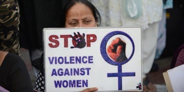 A woman attends a peace protest in Ahmedabad on March 20, 2015, in the wake of the gang-rape on an elderly nun. An Indian state government, West Bengal, was under pressure over the rape of an elderly nun said March 18 it was handing over the case to the country's top investigators after coming under fire over the lack of arrests. AFP PHOTO / Sam PANTHAKY (Photo credit should read SAM PANTHAKY/AFP/Getty Images)